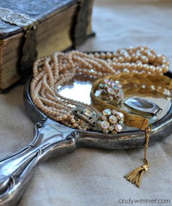 Antique hand-held mirror with vintage pearls and rhinestones